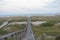 The wooden boardwalk narrows as it approaches the water`s edge