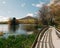 A wooden boardwalk over Abbott Lake and view of Sharp Top Mountain at, Peaks of Otter on the Blue Ridge Parkway, Virginia