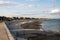 Wooden boardwalk stretching along the beach in Selsey, West Sussex, United Kingdom.