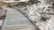 Wooden boardwalk trail, sand dune, California coast. Footpath walkway or footway