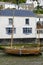 Wooden boat aground and old house, Polperro