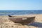 Wooden boat on the coast of the cold Baltic Sea