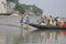 Wooden boat crosses the Ganges River in Gosaba, West Bengal, India