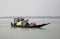 Wooden boat crosses the Ganges River in Sundarbans, West Bengal, India