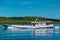 Wooden boat cruising Maratua coast, Borneo