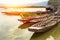 Wooden boat float in reservoir with sunlight, mountain