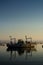 Wooden Boat Moored Among Mussel Plantation in the Mar Piccolo in Taranto in the South of Italy at Sunrise