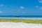 Wooden boat at the Nungwi Beach, Zanzibar with stunning turquoise water and copy space for text