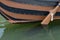 Wooden boat with a paddle closeup