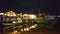 Wooden boat stops by the river at night