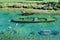 Wooden boat submerged under water