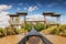 Wooden boat travels under wooden bridge on canal, Inle Lake, Shan State, Myanmar