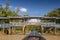 Wooden boat travels under wooden bridge on canal, Inle Lake, Shan State, Myanmar