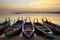 Wooden boat in Ubein Bridge at sunrise, Mandalay, Myanmar