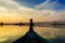 Wooden boat in Ubein Bridge at sunrise, Mandalay, Myanmar