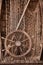 Wooden boat wall composition with fishing net andvitage ship`s wheel helm. Art desing