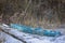 Wooden boat at the winter lake. Abandoned boat