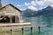 Wooden boathouse in Sankt Wolfgang am Wolfgangsee surrounded by alps