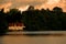 Wooden boathouse on a tranquil lake, Virginia Water.