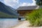 Wooden boathouse at waterfront of alpine lake plansee