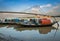 Wooden boats lined up on river Hooghly at Princep Ghat with Vidyasagar bridge (setu) at the backdrop