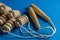 Wooden body massager with rolls on blue background