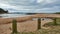 Wooden bollards to prevent vehicular access to the beach