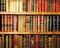 Wooden bookshelf with antique books in a library. A treasure of human knowledge