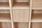 Wooden bookshelves. Wooden bookcases and wall panels made of oak veneered MDF