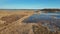 Wooden Bords Trail Through the Kaniera Lake Reeds Aerial Spring Shot Lapmezciems, Latvia.