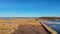 Wooden Bords Trail Through the Kaniera Lake Reeds Aerial Spring Shot Lapmezciems, Latvia