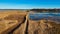 Wooden Bords Trail Through the Kaniera Lake Reeds Aerial Spring Shot Lapmezciems, Latvia