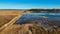 Wooden Bords Trail Through the Kaniera Lake Reeds Aerial Spring Shot Lapmezciems, Latvia