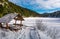 Wooden bower in snowy winter spruce forest