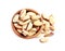 Wooden bowl with Brazil nuts on white background