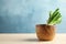 Wooden bowl with bunch of wild garlic or ramson on table against color background