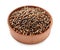 Wooden bowl of coriander grains on white background