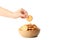 Wooden bowl with cracker biscuits and female hand holds cracker, isolated on white background