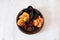 Wooden bowl with dried fruits and berries on white background