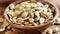 A wooden bowl filled with assorted nuts sits atop a table, creating a rustic and inviting display