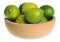 Wooden bowl filled with limes