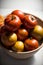 A Wooden Bowl Filled With Lots Of Ripe Tomatoes. Generative AI