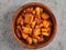 Wooden bowl of fresh bread rusks, isolated on grey background