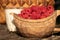 Wooden bowl with fresh ripe rasberries and a glass of milk