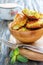 Wooden bowl with fritters made from zucchini.