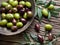 Wooden bowl full of olives.