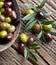 Wooden bowl full of olives.