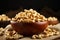 Wooden bowl holds cashew nuts on rustic burlap cloth backdrop