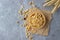 Wooden bowl of muesli on burlap napkin. Top view with copy space.