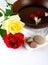 Wooden bowl with white towel and scattered pebbles